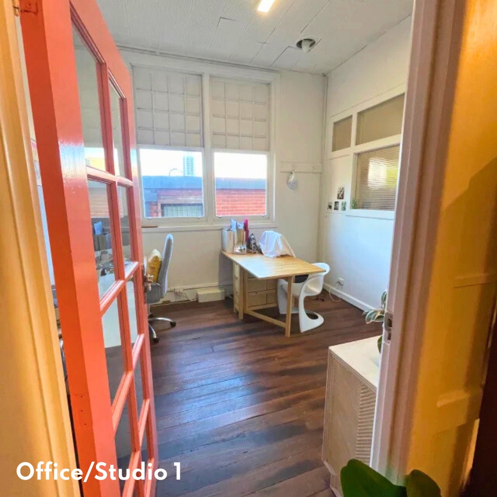 Studio 1 — private office with coral French doors and timber floors